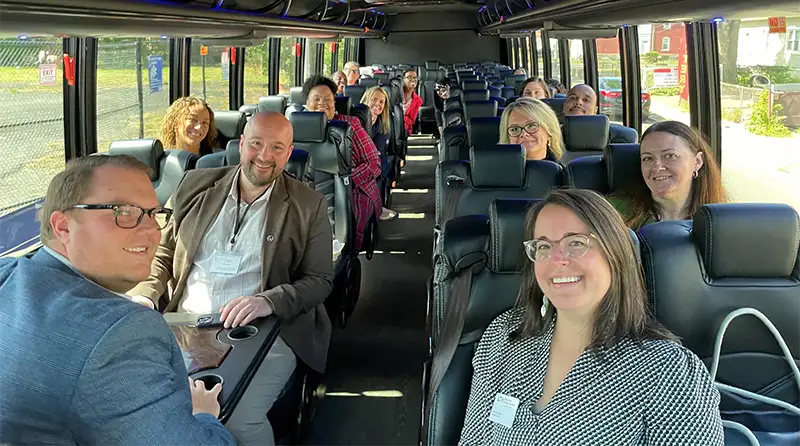 LGH team members riding on a bus together