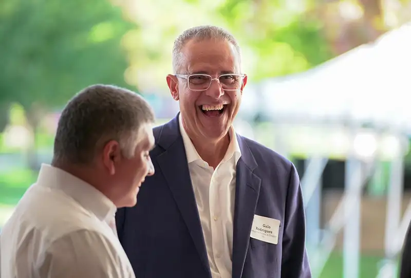 A businessman smiling and laughing
