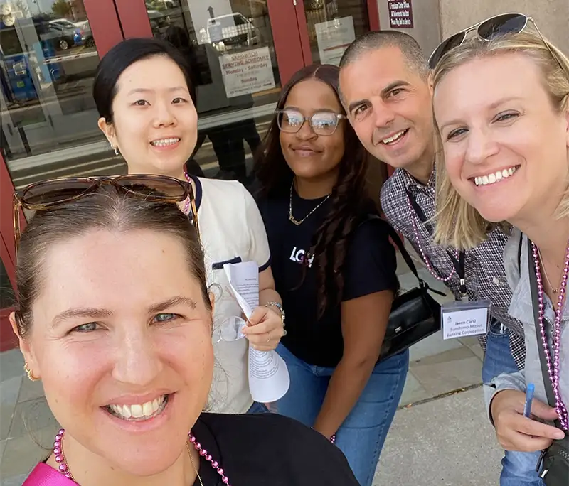 A selfie of some smiling Quest program members