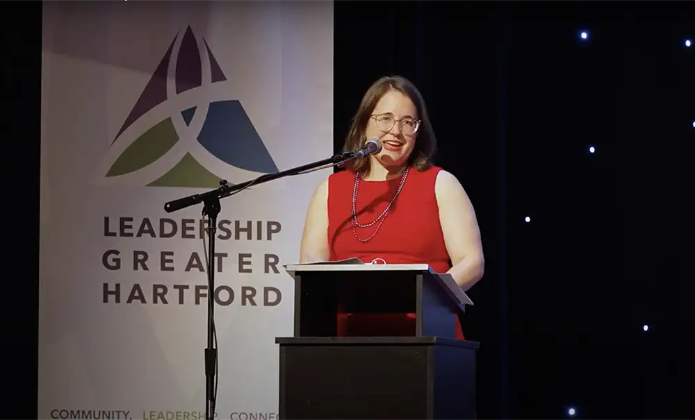 Larisa speaking on stage at Polaris 2024